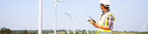 Man looking at windmills | SAE Inc.