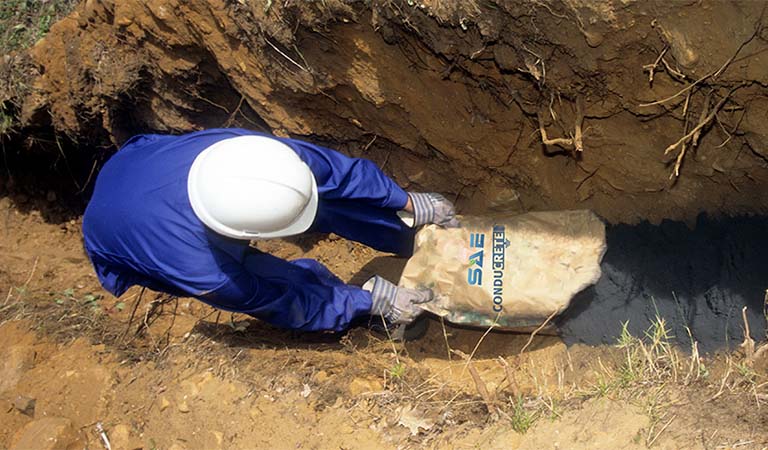 Man pouring SAE Conducrete