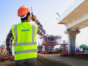 Construction worker talking on walkie-talkie